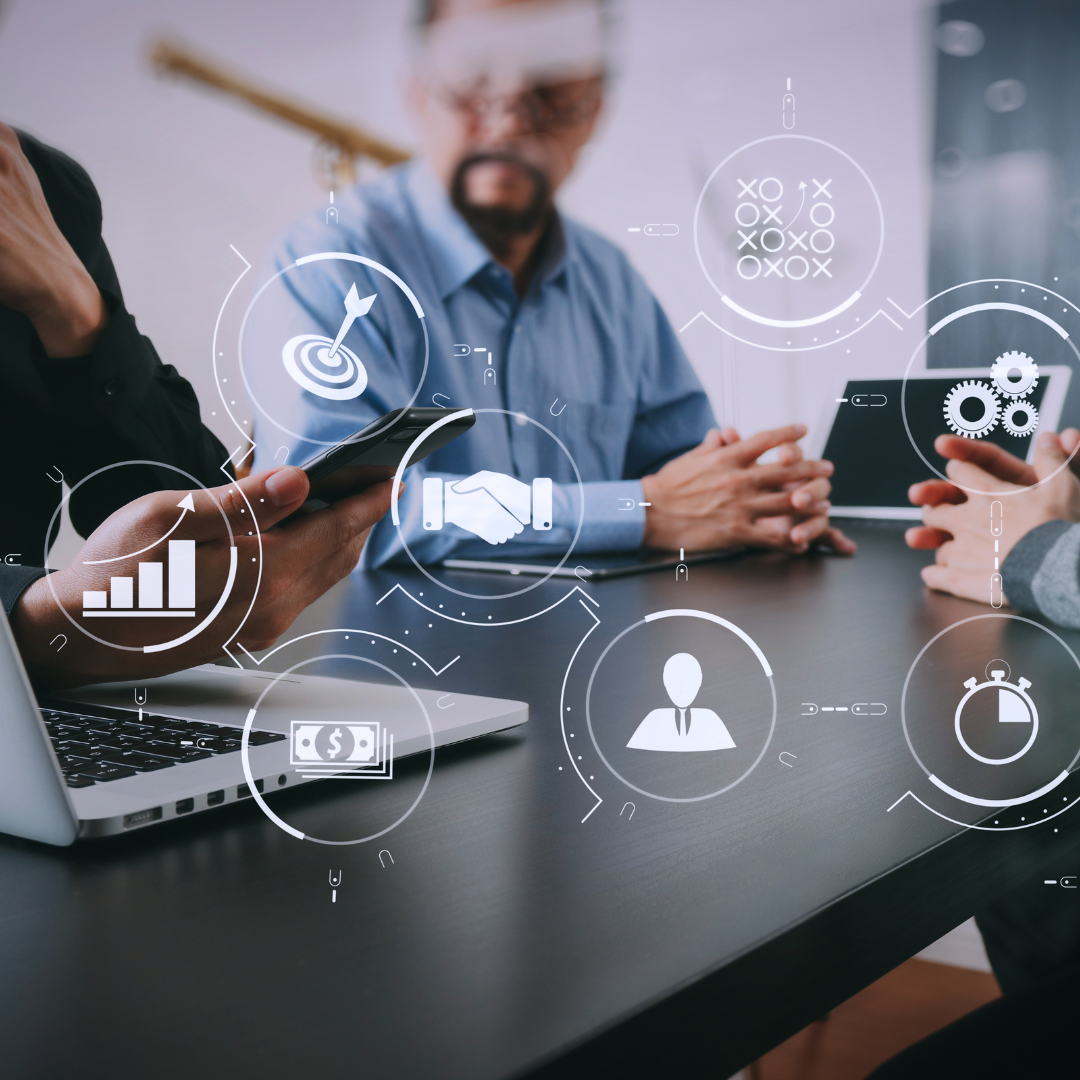 People collaborating at the office with an overlay of icons representing different parts of a business