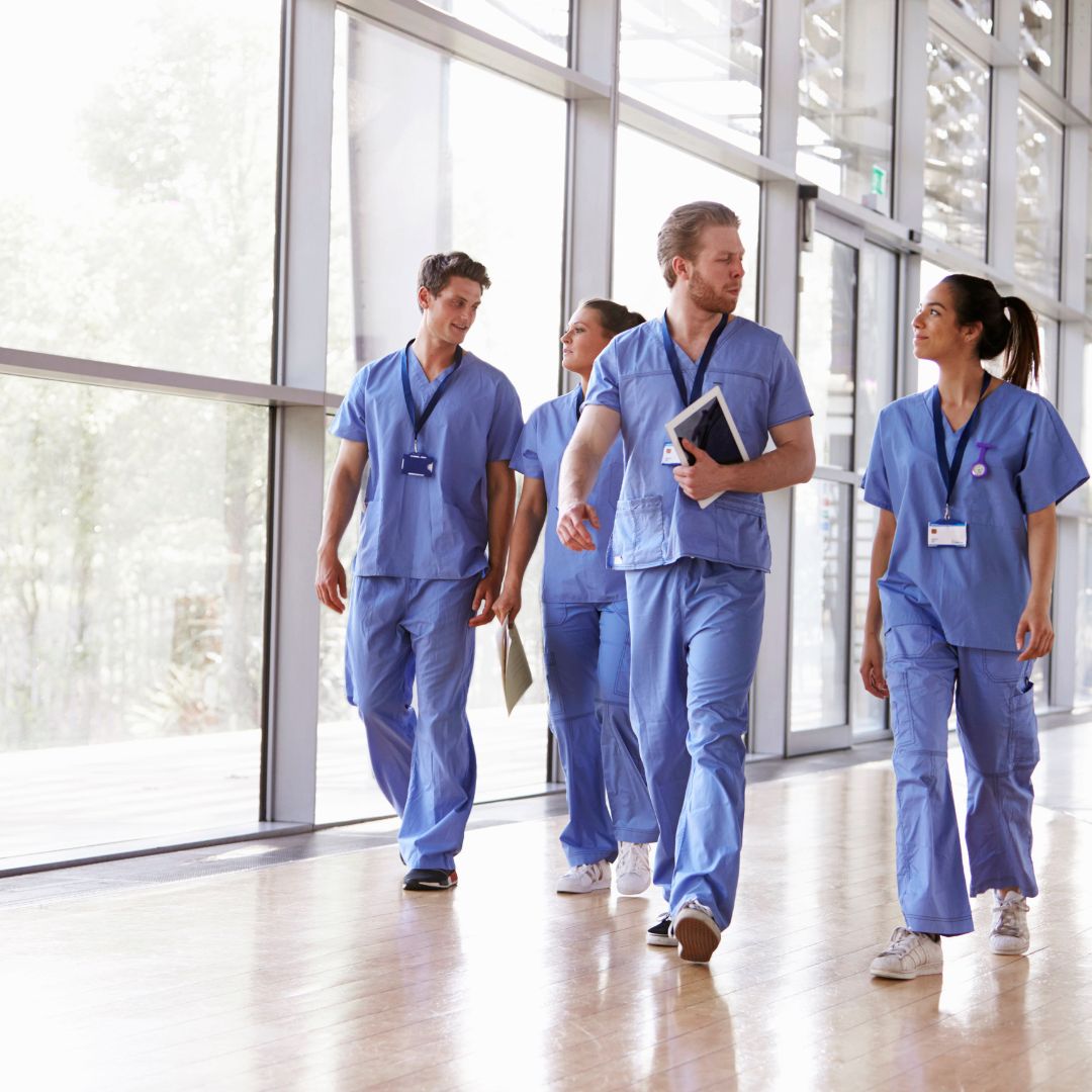 healthcare workers walking in hallway