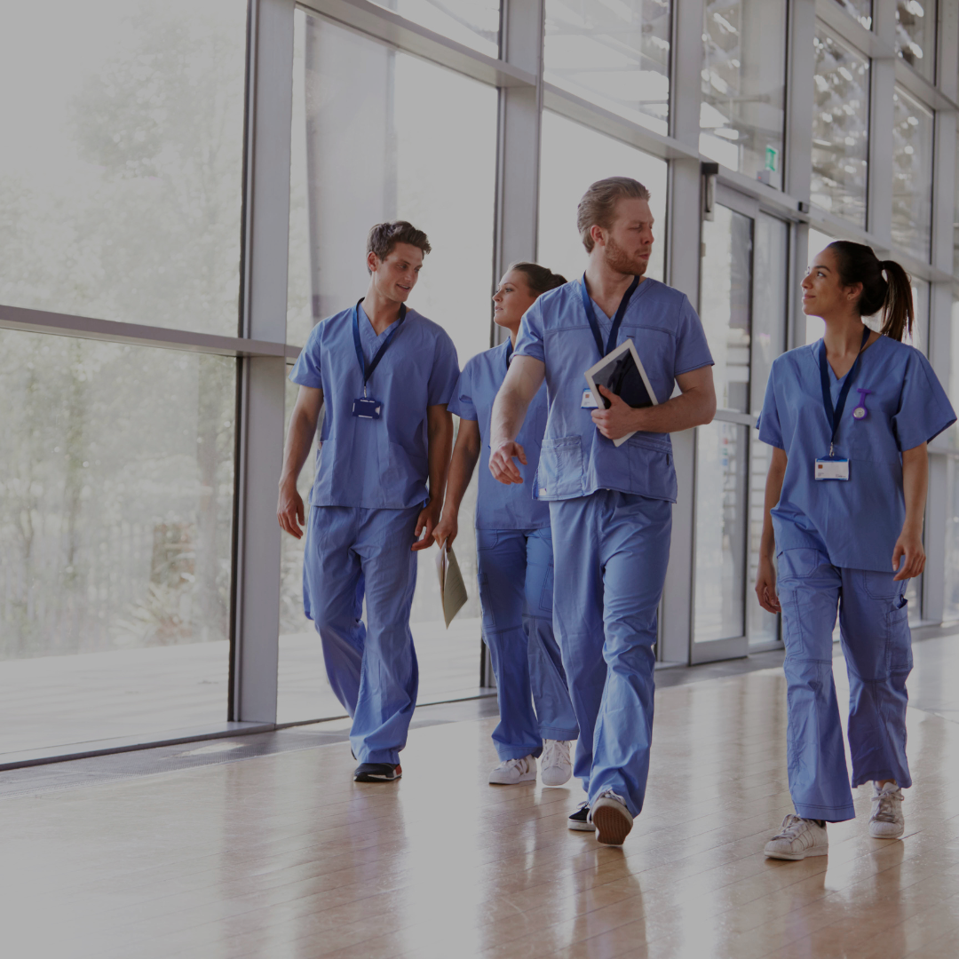 Healthcare workers walking in a hallway