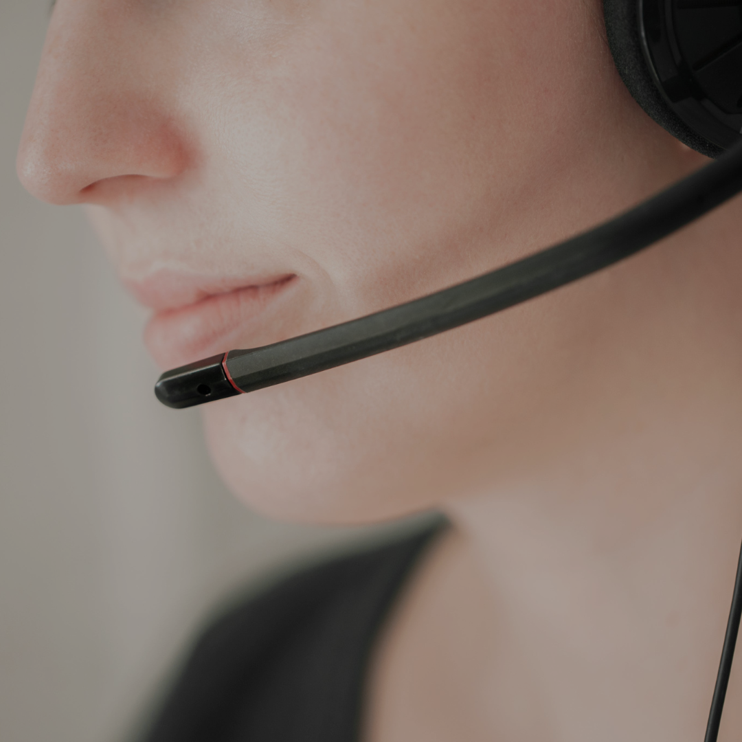 A woman with a headset at a call Centre