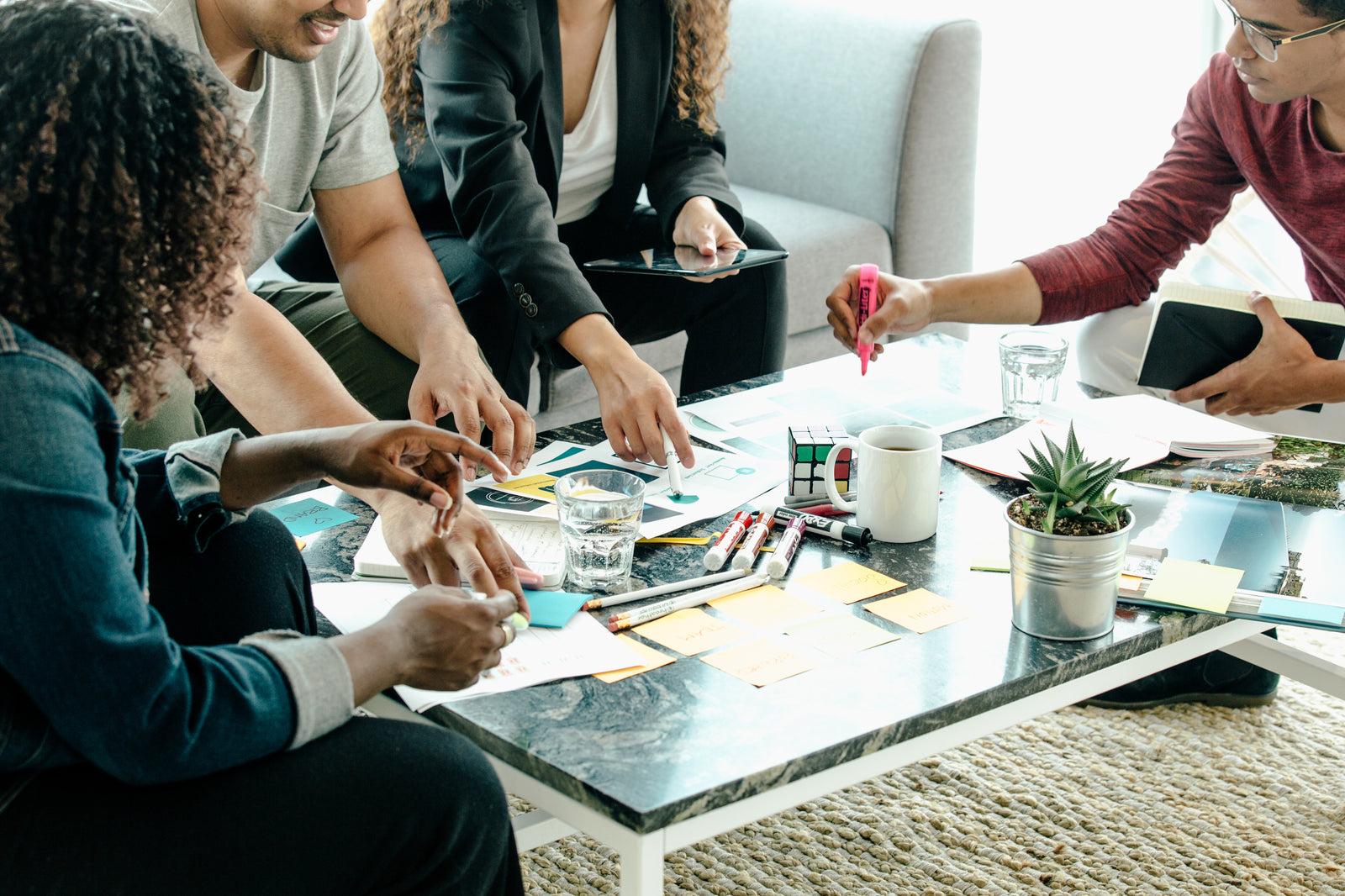People brainstorming on a coffee table