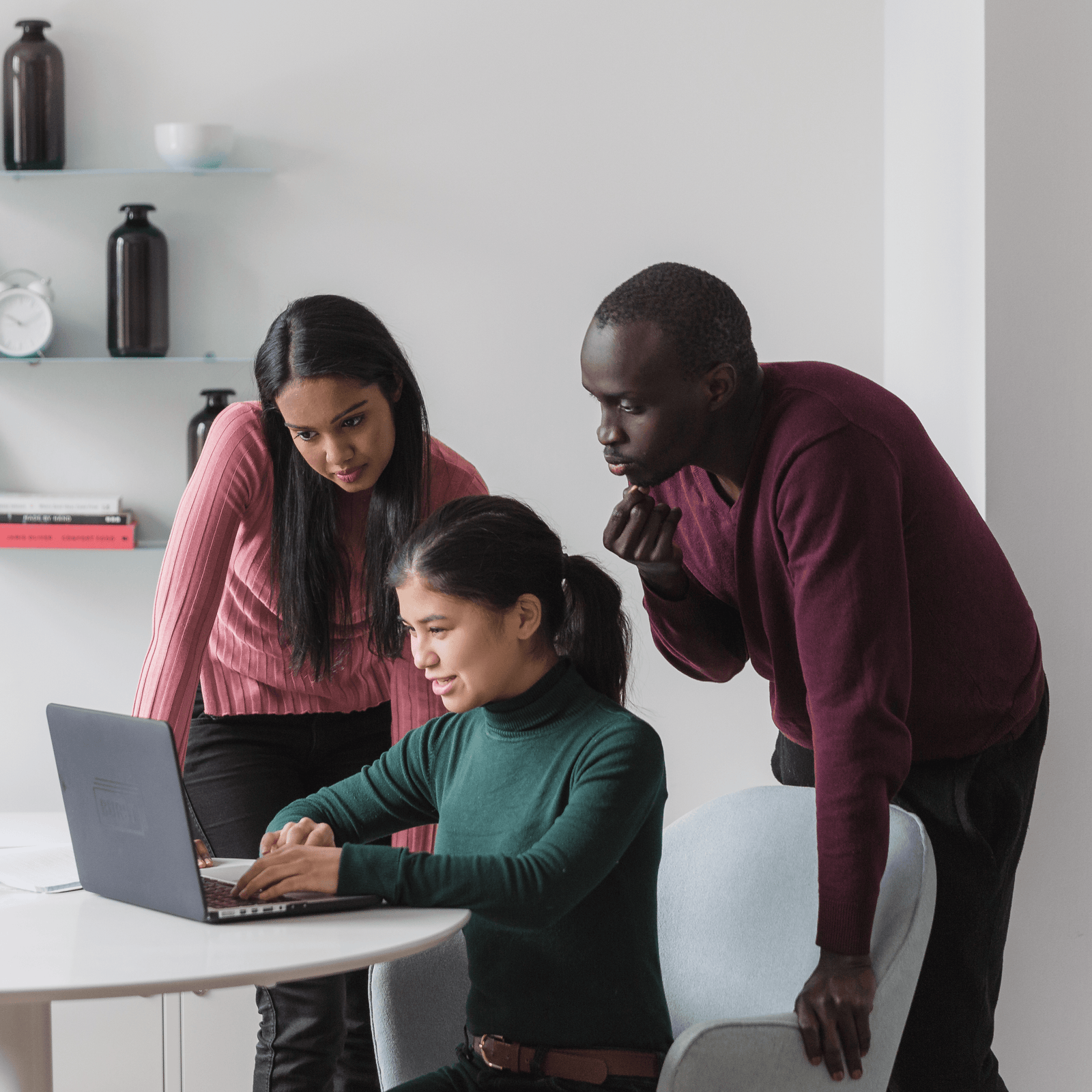 People looking at a laptop