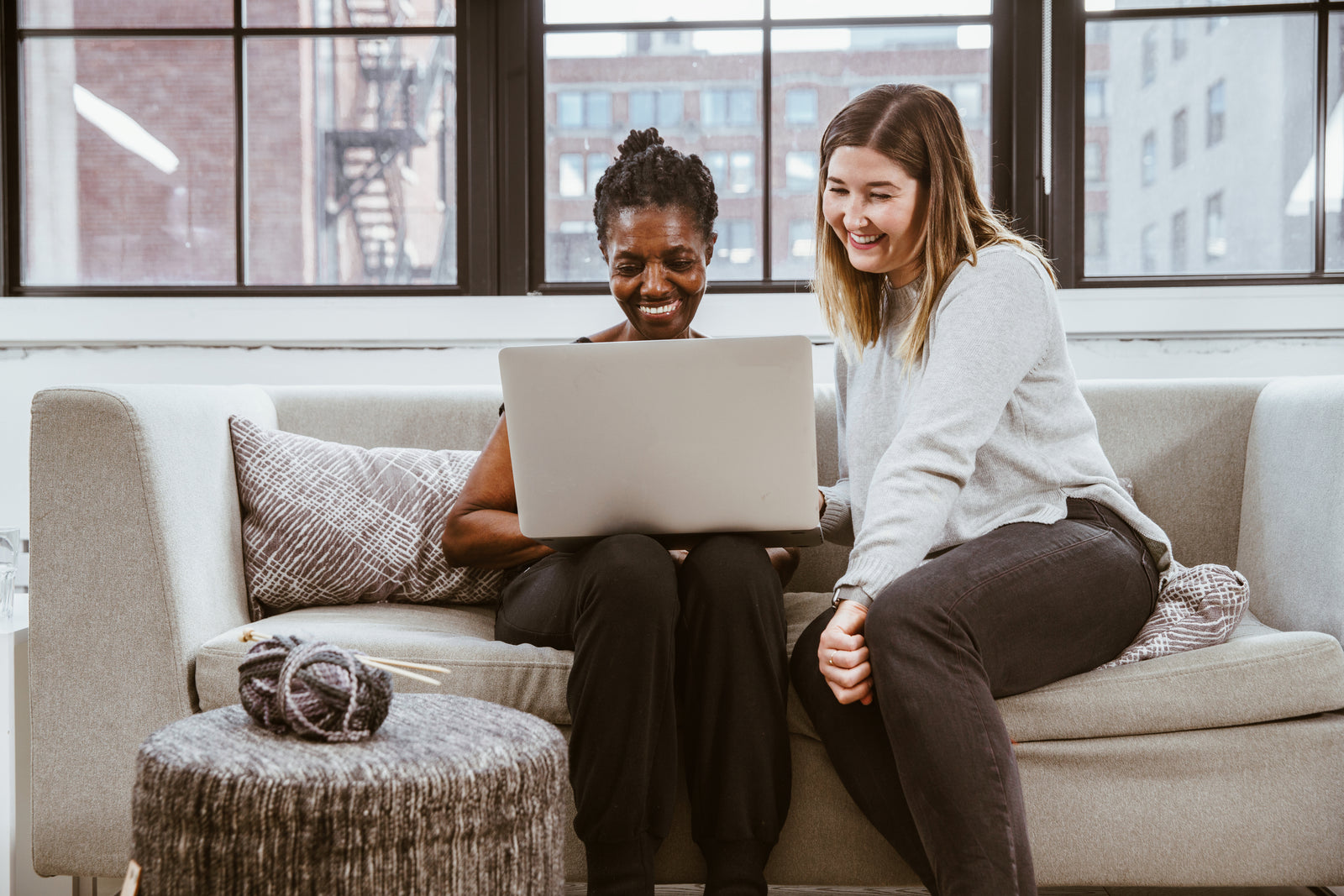 two women learning on computer