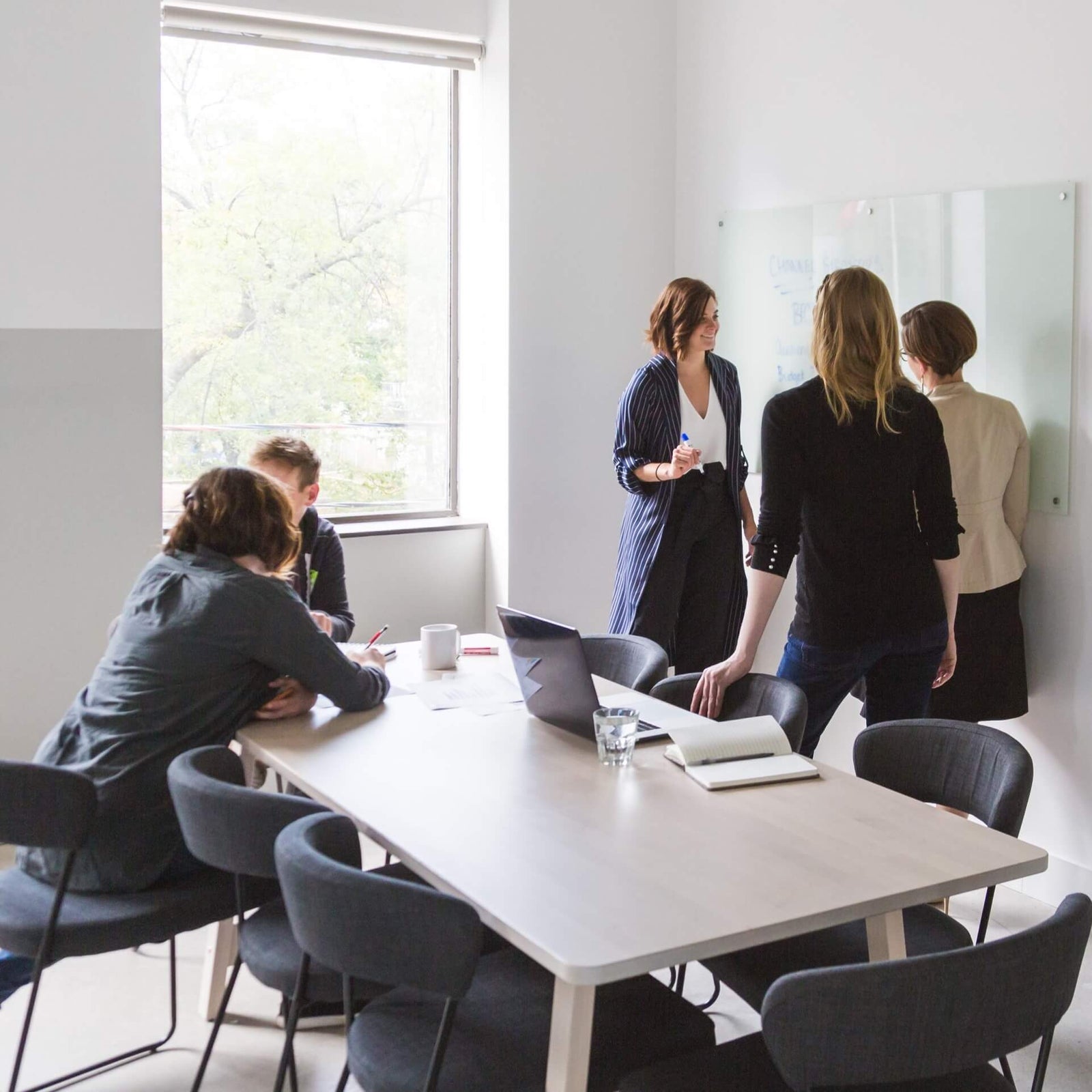 Team brainstorming on a whiteboard
