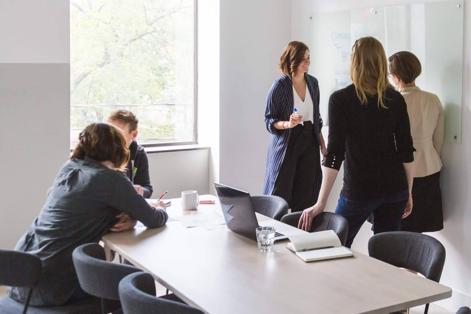 Team brainstorming on a whiteboard